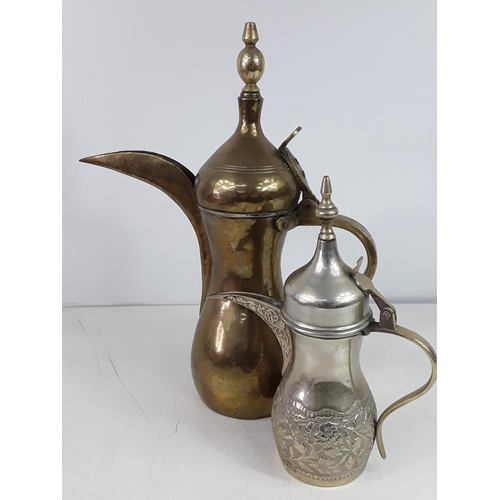 35 - 2 Eastern brass coffee pots