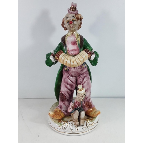 86 - Porcelain clown figure approx 20 inches tall