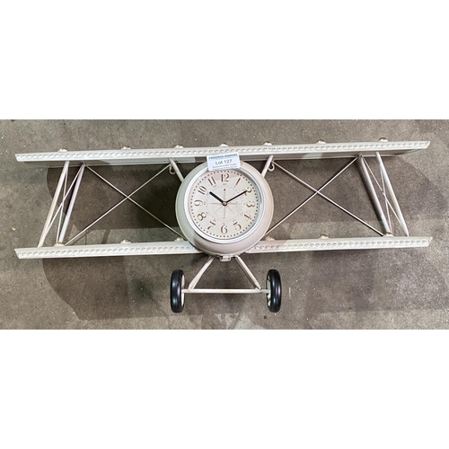 127 - CLOCK IN THE FORM OF A BI-PLANE