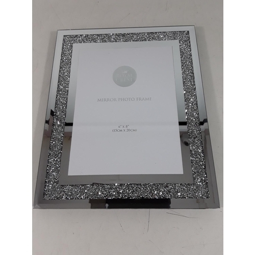 143 - New and boxed mirrored photo frame