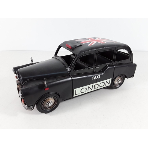 151 - Boxed tin plate London taxi