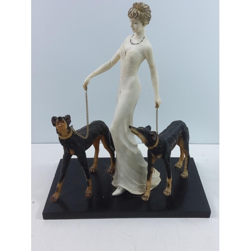 186 - Large figure of a lady and dogs