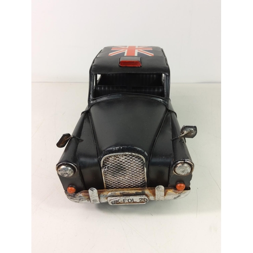 104 - Tin plate London taxi
