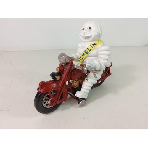 231 - Cast metal Michelin man on motorcycle