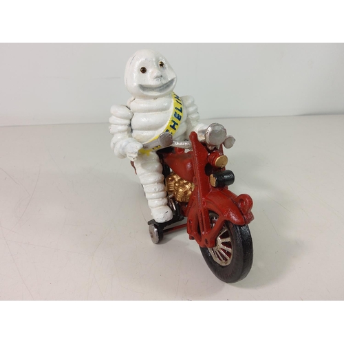 231 - Cast metal Michelin man on motorcycle