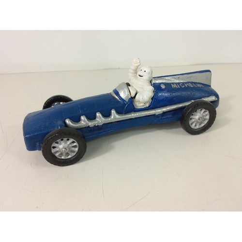 232 - Cast metal Michelin man racing car
