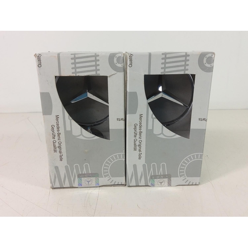 202 - 2 boxed Mercedes badges
