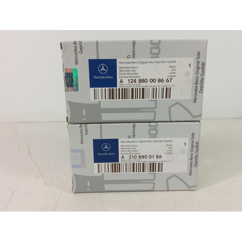 202 - 2 boxed Mercedes badges