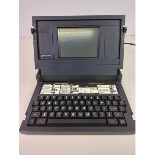 86 - Vintage early Grid Compass computer model 1101 with original dustcover and lead