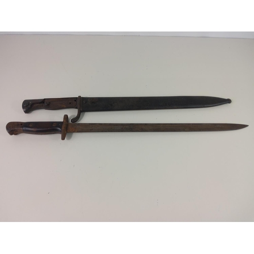 518 - 2 vintage bayonets, one with sheath