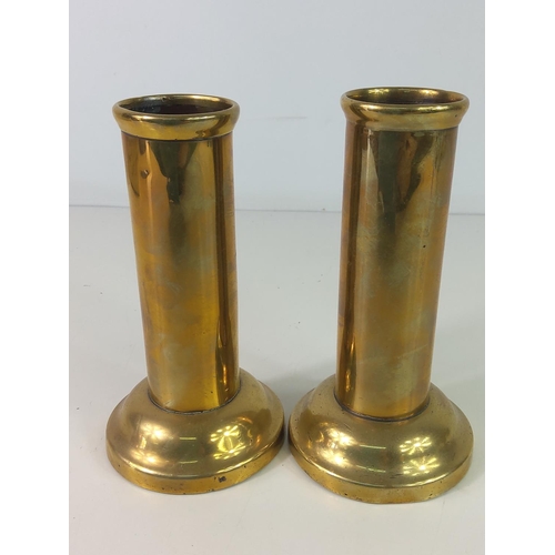 127 - Pair of weighted brass vases