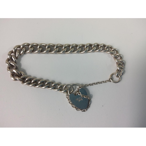 424 - Silver bracelet with heart locket, 20.7g