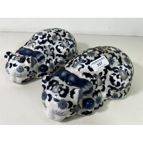 357 - Pair of blue and white porcelain cat figures