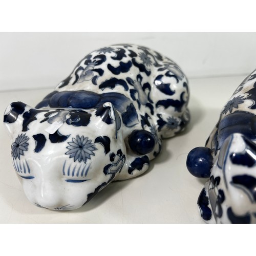 357 - Pair of blue and white porcelain cat figures