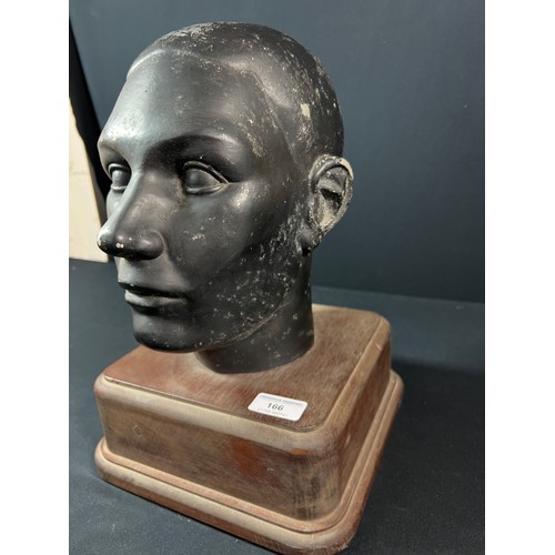 166 - Life size cast aluminum head on wooden plinth - overall height approx 35cm