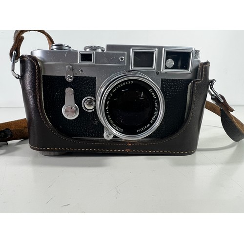 352 - Vintage leather cased Leica D8pm3 camera and lens