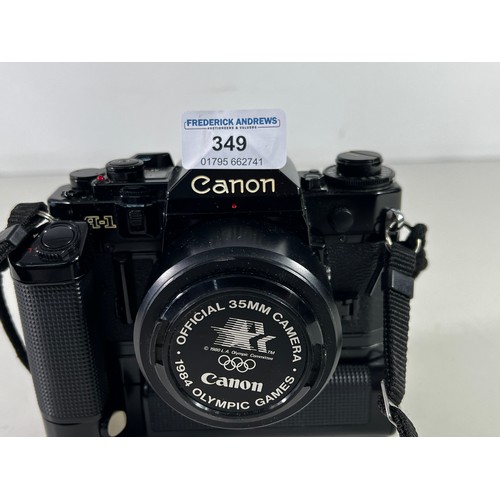 349 - Canon A1 with winder and lens with official Olympics lens cap