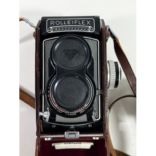 348 - Rolleiflex leather cased camera