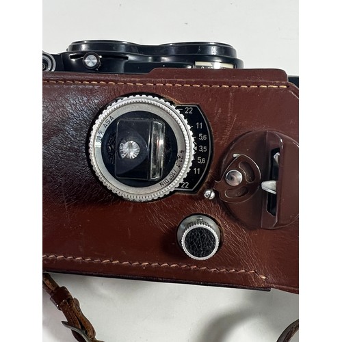 348 - Rolleiflex leather cased camera