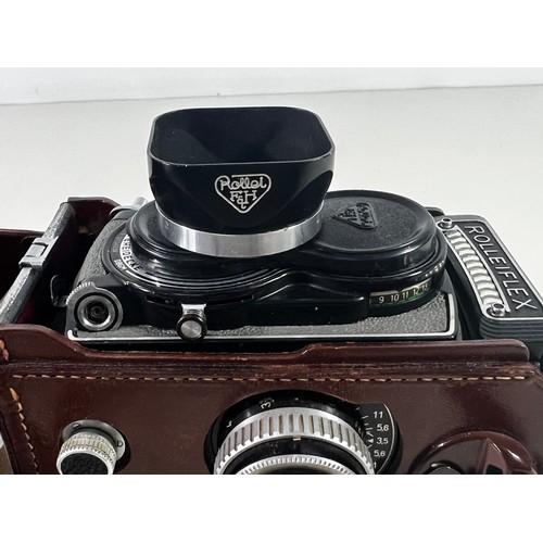 348 - Rolleiflex leather cased camera