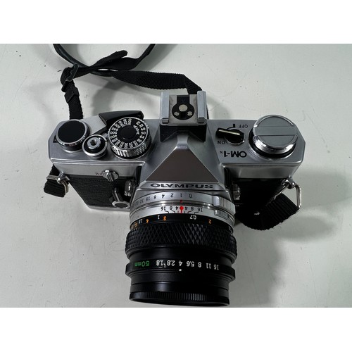 341 - Olympus OM1 camera and lens