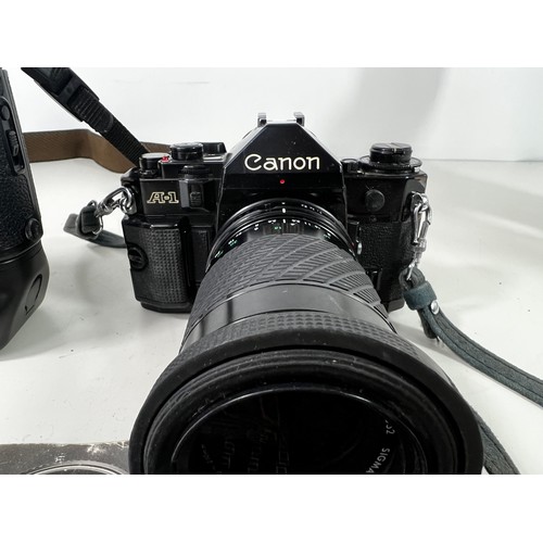 339 - Canon AE1 with Sigma lens and Canon EOS-1N boxed camera