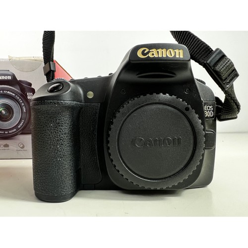 337 - Boxed Canon EOS30D camera and EOS60D boxed accessories