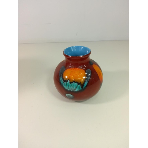 134 - Large Poole vase (24cm tall) and small Poole vase -(11cm tall)