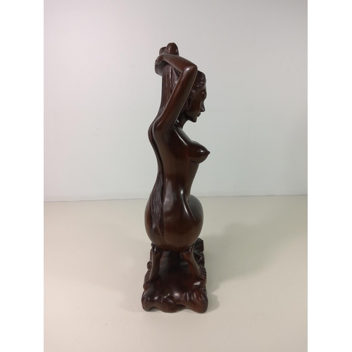 73 - Polynesian carved hardwood figure of a nude lady - overall height 45cm