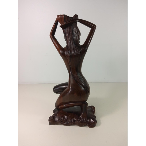 73 - Polynesian carved hardwood figure of a nude lady - overall height 45cm