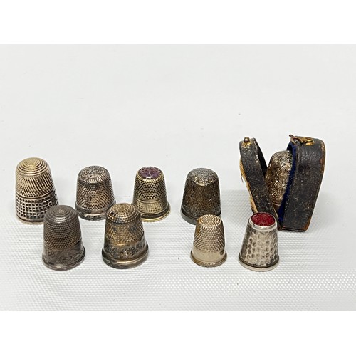 642 - 9 various thimbles including silver - silver weight 26.3g