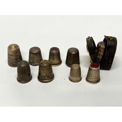 642 - 9 various thimbles including silver - silver weight 26.3g