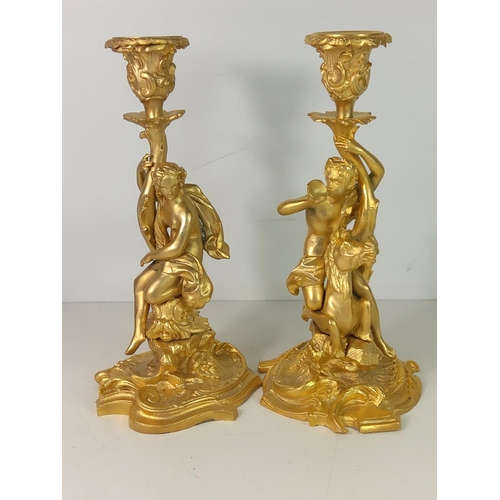 53 - Pair of ornate gilded bronze candlesticks, 29cms in height