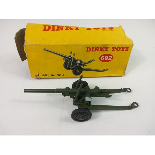 114 - 3 boxed Dinky items, 771 International Road Signs, 692 5.5 Medium Gun and 27K Hay Rack