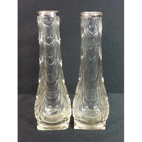 310 - Pair of silver top vases, height 20cms