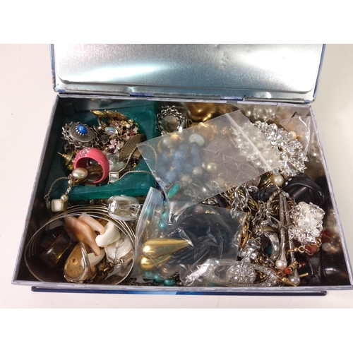 Tin of costume jewellery