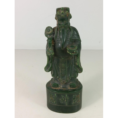 307 - Carved jade green figure of an Oriental God, approx 21cms tall