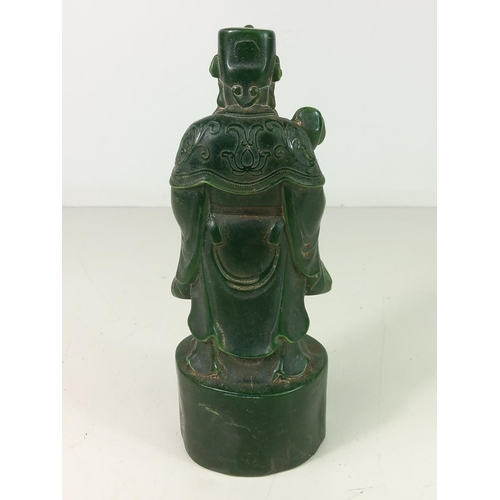 307 - Carved jade green figure of an Oriental God, approx 21cms tall