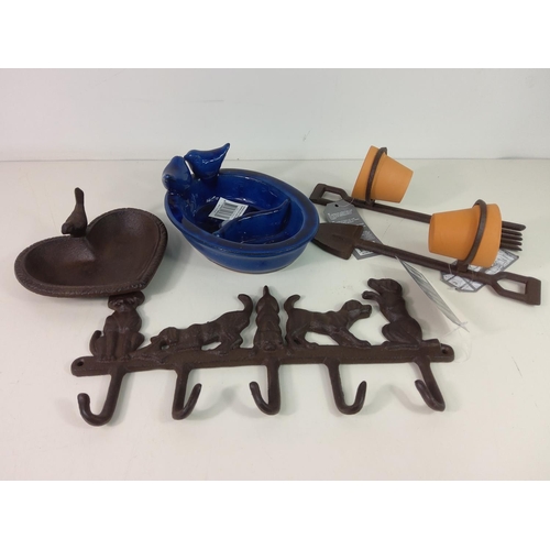 214 - Cast iron bird bath, ceramic bird feeder, 2 pot holders with pots and cast iron wall hanger