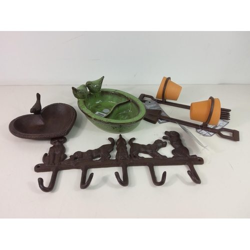 216 - Cast iron bird bath, ceramic bird feeder, 2 pot holders with pots and cast iron wall hanger