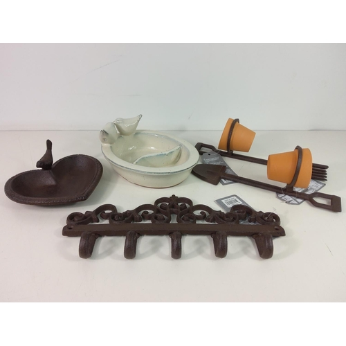 217 - Cast iron bird bath, ceramic bird feeder, 2 pot holders with pots and cast iron wall hanger