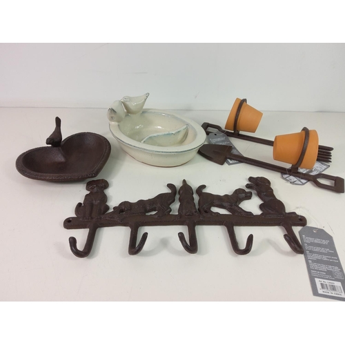 218 - Cast iron bird bath, ceramic bird feeder, 2 pot holders with pots and cast iron wall hanger