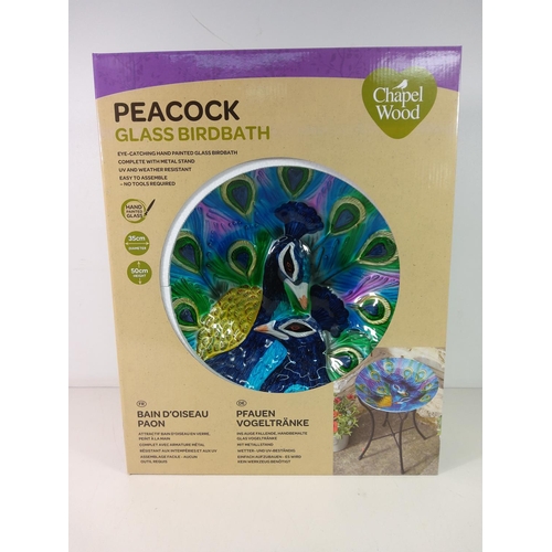 225 - Glass peacock bird bath, new and boxed