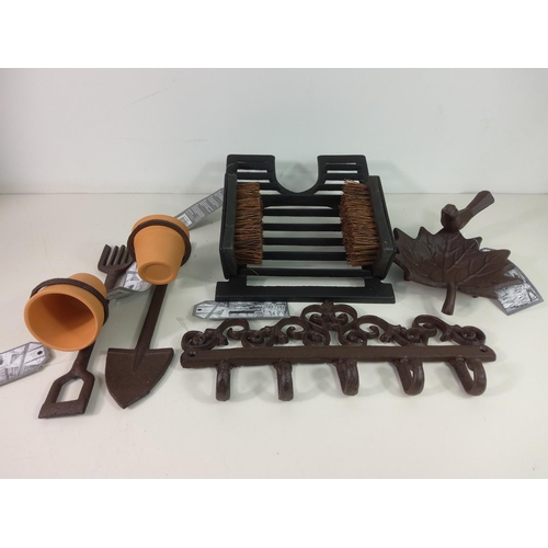 230 - Cast iron bird bath, cast iron wall hanger, 2 cast iron pot holders and boot brush