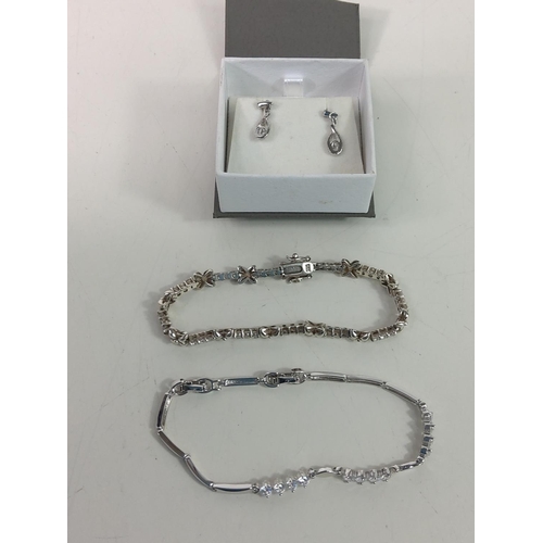 374 - 1 silver bracelet, a bracelet and set of earrings