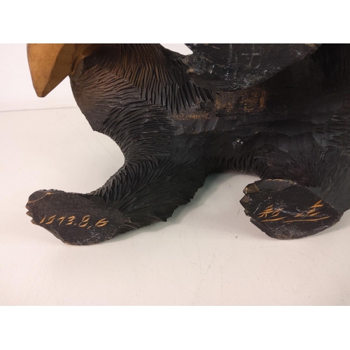 211 - Signed carved wooden bear with fish