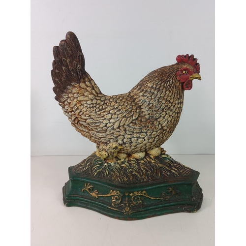 287 - 2 cast iron chicken doorstops