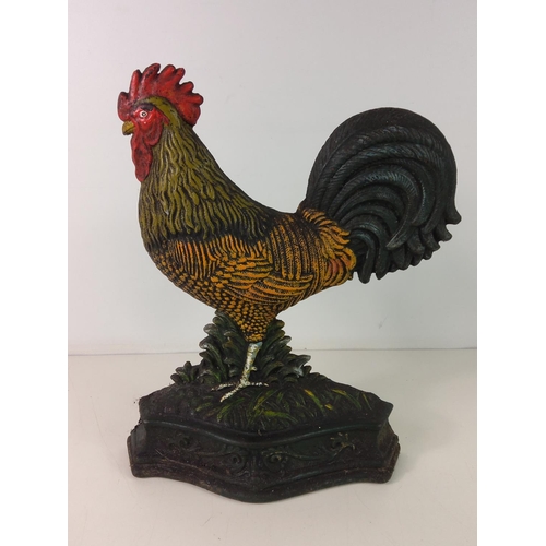 287 - 2 cast iron chicken doorstops