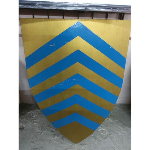 121 - 2 decorated wooden shields, 60cms x 57cms & 79cms x 72cms