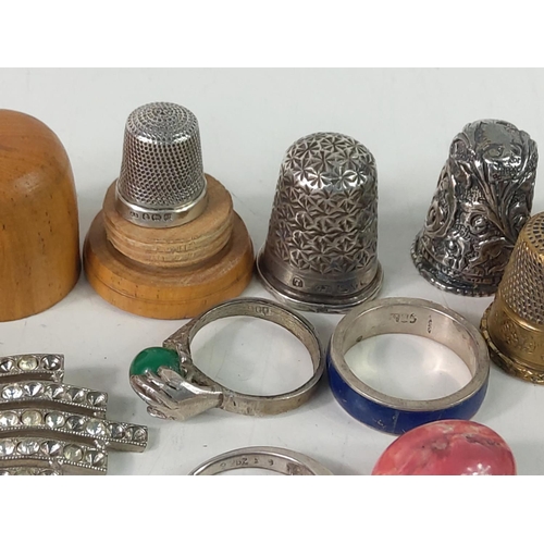 649 - Thimbles and interesting items, including silver rings